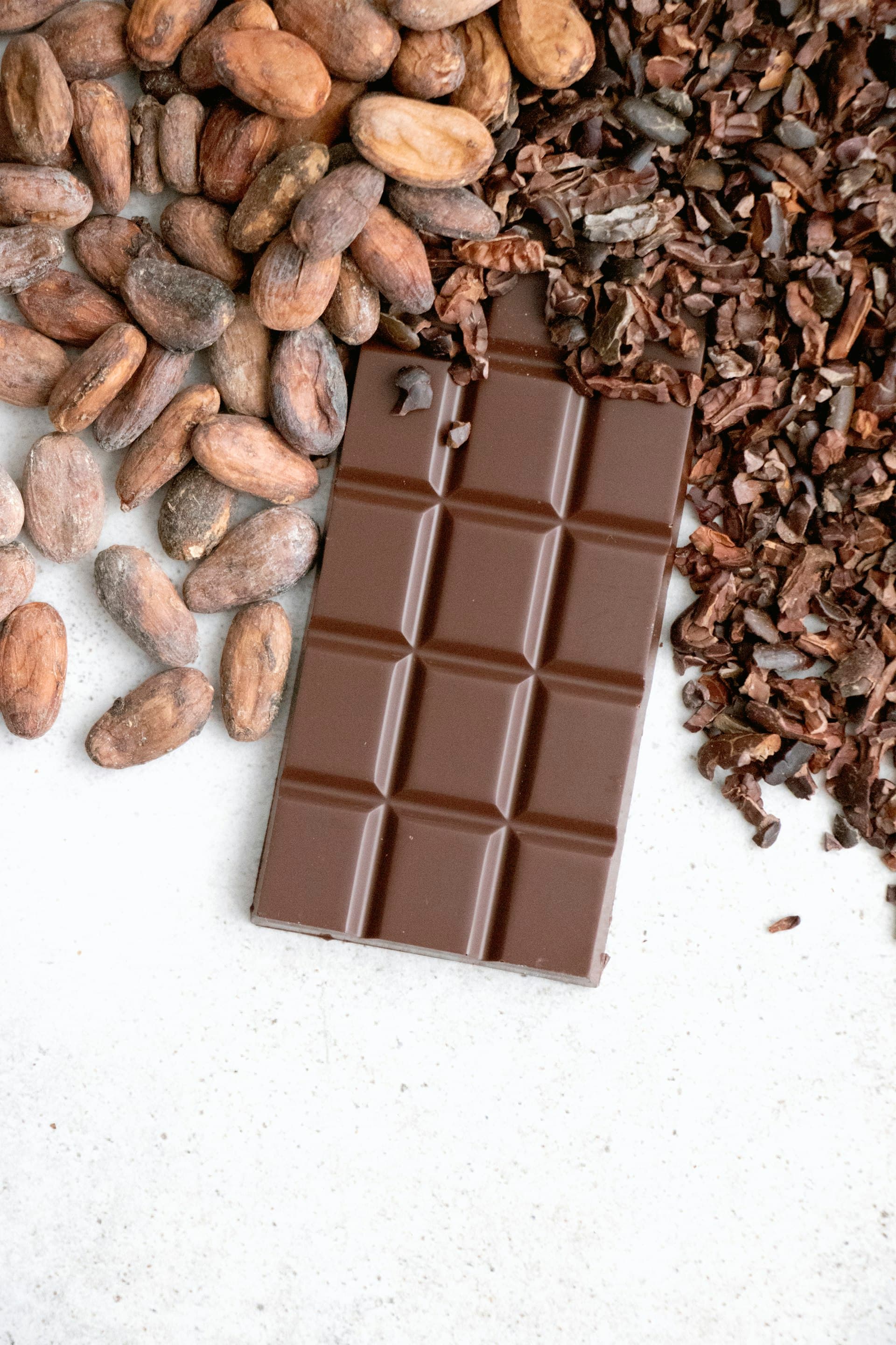Cacao beans fermenting in wooden boxes, developing chocolate flavor